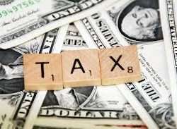 money with the word tax on top