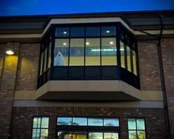 Image of outside of library building with ghost standing in window