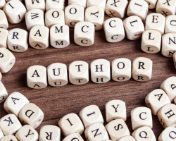 Letter dice spelling out author